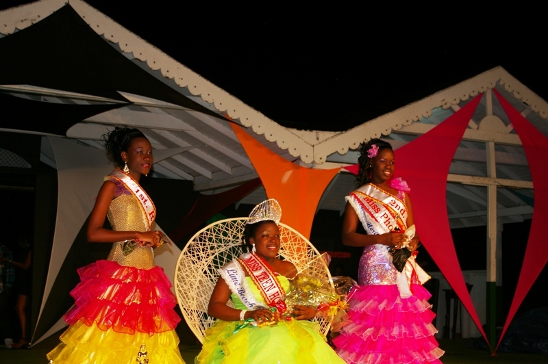 Former Miss Teen Hospitality 2011, Miss Erica Doras adjusting the crown after it was placed by Premier of Nevis, Hon. Joseph Parry on Miss Kevonie Pemberton, Miss Teen Hospitality 2012